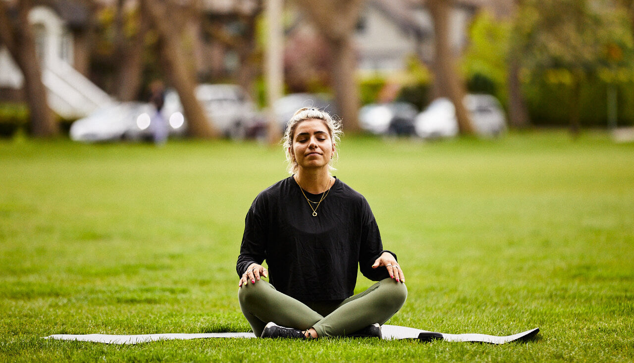 Woman sitting, and meditating