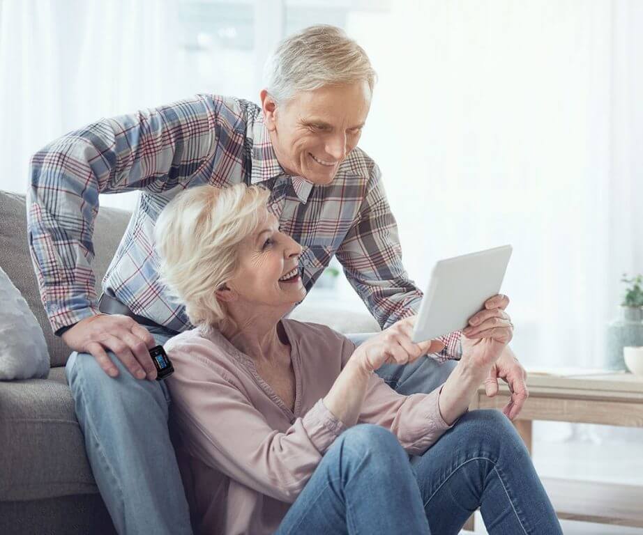 Happy elder couple using iHeart HRV app